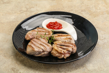 Grilled pork tenderlion with tomato sauce