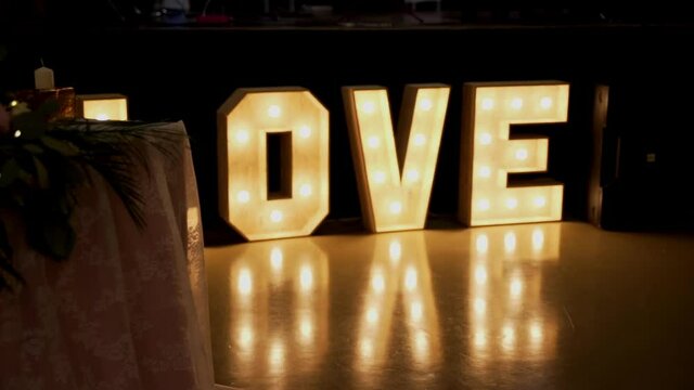 luminous word LOVE, volumetric letters