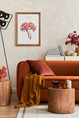 Creative composition of stylish living room interior with mock up poster frame, orange sofa, beige...