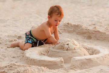 Child destroy sand castle.
