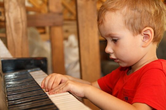 Piano child music instrument musical,  sitting.