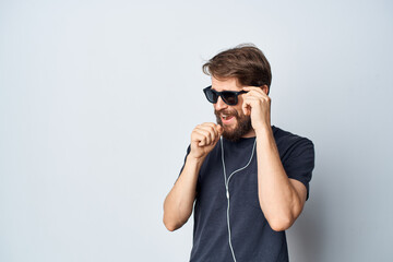 bearded man in a black t-shirt music in headphones movement isolated background