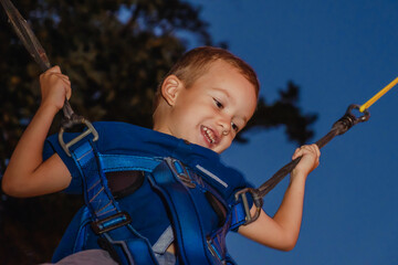 Boy jumping on the trampoline
