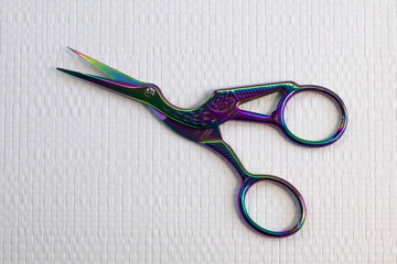 Holographic rainbow heron scissors for needlework with curly handles in the shape of bird, white...