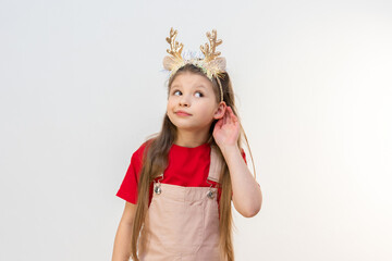A little girl in Christmas reindeer horns is eavesdropping on you.