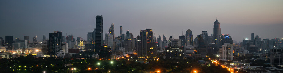Night cityscape and high-rise buildings in metropolis city center . Downtown business district in...