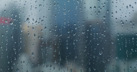Naklejka na ściany i meble Rain drop on window glass