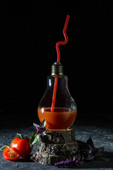 Tomato juice in a glass, cocktail on a wooden stand, simple composition, rustic style