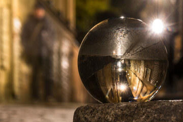 Stockholm, Sweden A crystal ball reflects Prastgatan in the Old Town or Gamla Stan.