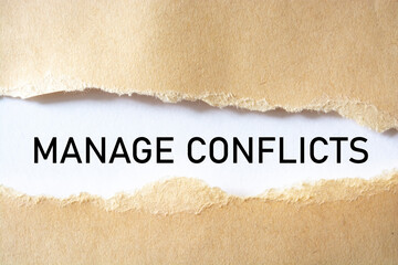 MANAGE CONFLICTS. words. text on brown paper on torn paper background.