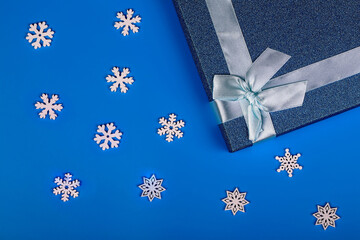 Christmas background. Gift Boxes. Snowflakes. Blue background. Top view. Close-up.