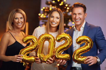 Beautiful young friends having fun at New Year's Eve Party 2022