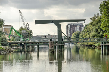 Rotterdam, The Netherlands, October 7, 2021: the new Ben Schop bridge forcyclists and pedestrians across Zuiddiepje river channel to revitalised Brienenoord island