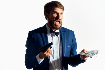 man in a suit with a gun in hand isolated background
