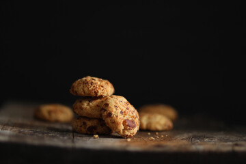 Chocolate cookies on wooden table.