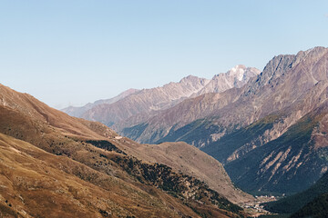 High mountains of Russia. The beauty of the North Caucasus. High quality photo. Clear blue sky at sunset