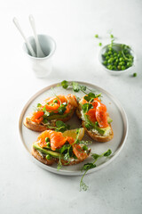 Homemade salmon bruschetta with green pea