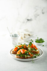 Homemade salmon bruschetta with green pea