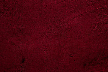 Crimson colored wall background with textures of different shades of crimson red
