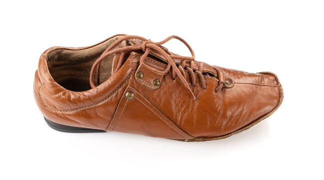Old vintage worn shoes on a white background