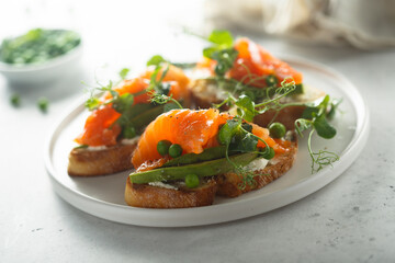 Homemade salmon bruschetta with green pea