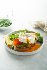 Salmon bruschetta with poached egg and asparagus