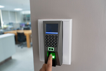 Finger scan on Finger scanner machine Security concept and safety. Businessman hand scanning finger on machine.