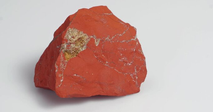 Jastic is red on a white background. Semi-precious ornamental stone.