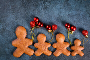 Homemade gingerbread cookies on dark background. Christmas composition, new year background. Number 2022 with cookies. Christmas dessert. New Year flatlay.