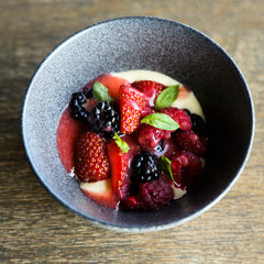 Custard with fresh berries and mint