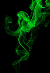 Green smoke abstract on black background for design. darkness concept