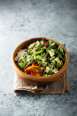 Healthy Buddha bowl with chicken and avocado