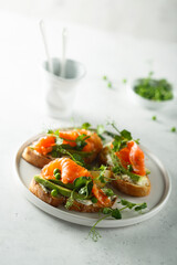 Homemade salmon bruschetta with green pea