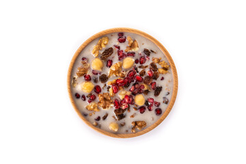 Traditional Turkish Noah's pudding in bowl isolated on white background