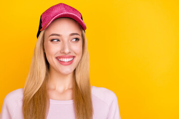 Photo of young cheerful girl happy positive smile curious look empty space isolated over yellow color background