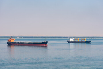 Ships sailing through the Suez Canal.