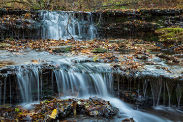 Fototapeta na wymiar Landscape with a small waterfall