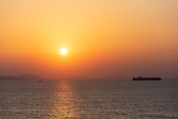 Fototapeta na wymiar Beautiful, golden sunset over the calm ocean.