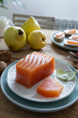 Homemade quince paste. Quince with cheese. Sweet snack at sunset