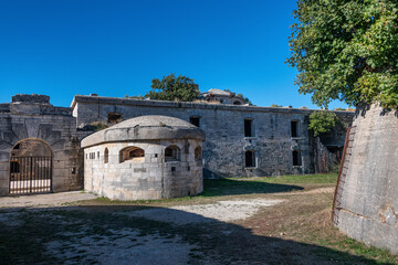 Fototapeta na wymiar Fort Forno, Part of the Barbariga Defence Groupin Istria. Forno Fortress is a coastal fortress located in Barbariga, which the Austrian Navy built in 1904 to protect its main port.