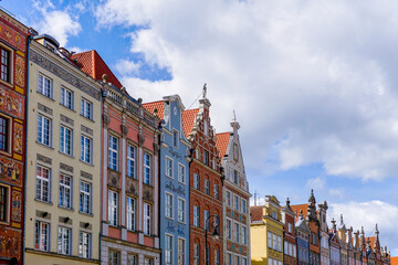 Obraz premium colorful house fronts of row houses on the riverfront of the Motlawa River in the Old Town of Gdansk