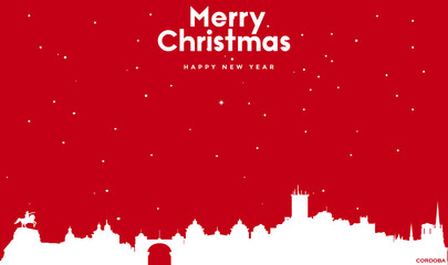 Christmas and new year red greeting card with white cityscape of Cordoba