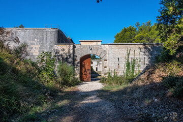 Fototapeta na wymiar Fort Benedetto, Part of the Barbariga Defence Groupin Istria. Forno Fortress is a coastal fortress located in Barbariga, which the Austrian Navy built in 1904 to protect its main port.