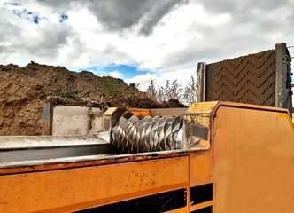 material has been aerobically converted to a homogenized compost, it can be screened. This...