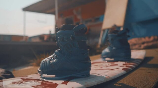 Boots fixed to the Wakeboard. Sunny Summer Day at Wakepark for Relaxation. The concept of water sports, active life