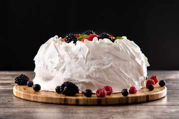 Delicious Pavlova cake with meringue topped and fresh berries