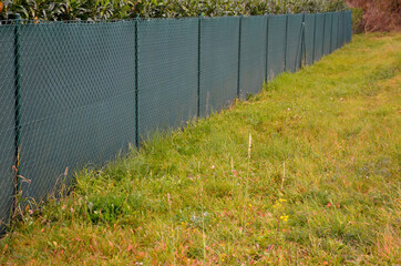 the shading fabric on the wire fence creates a private space and in a moment you have an opaque...