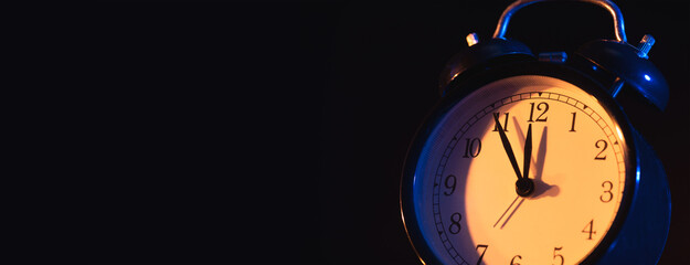 Five minutes to midnight on retro analog clock
