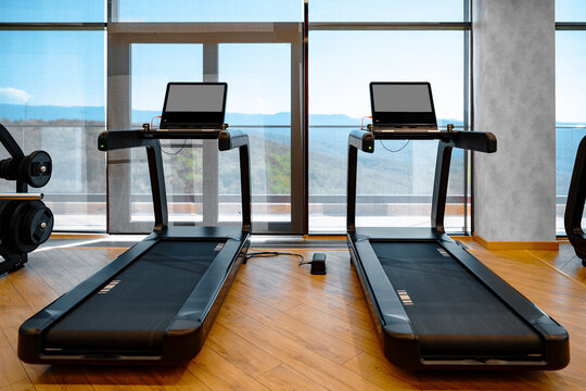 Studio shot of a professional treadmill in modern gym