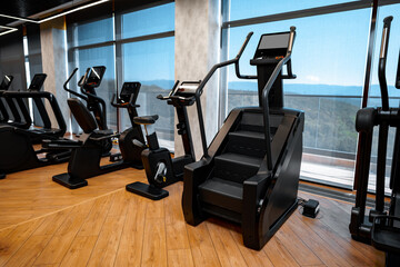 Fototapeta na wymiar Modern gym interior with new fitness equipment